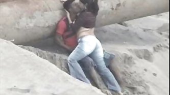 Latino pair caught on the beach